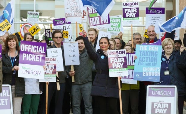 group of people protesting with signs