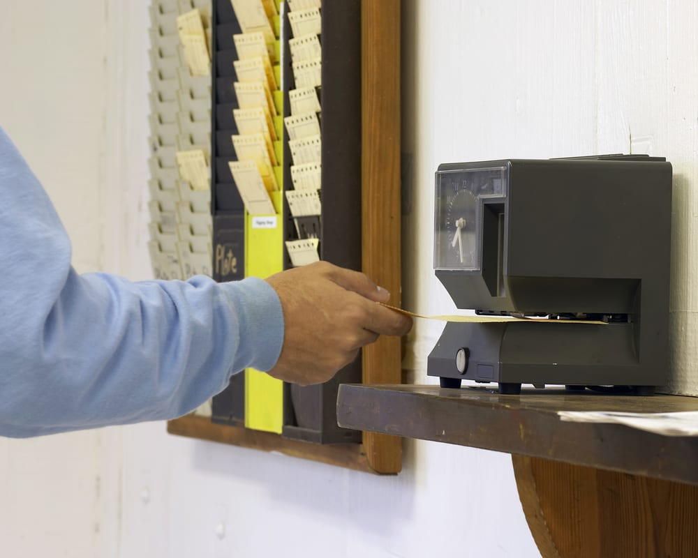 man clocking in workplace