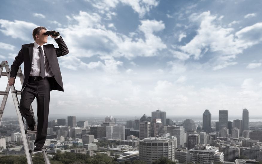 bsuiness man overlooking city skyline