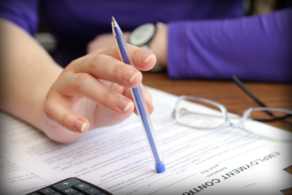 woman filling out claim form