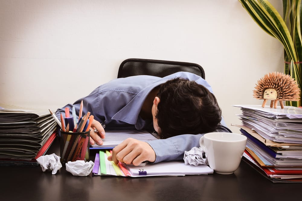 tired employee working at his desk
