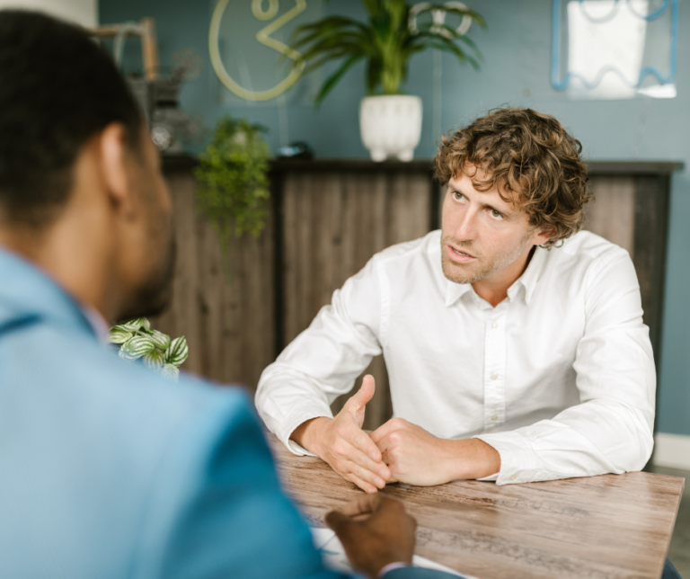 Two employees having a serious discussion.